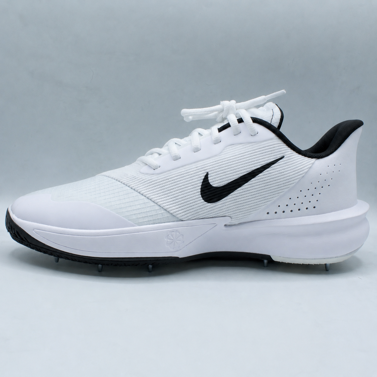 Pre-spiked Nike Precision 7